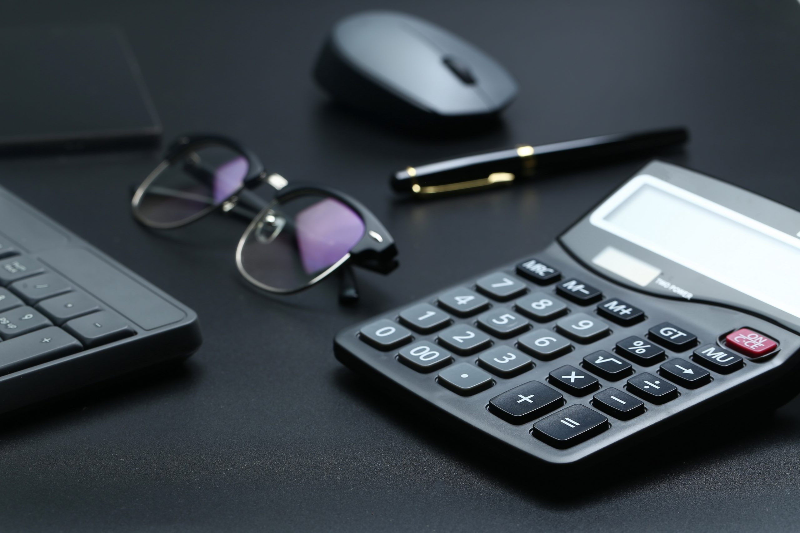 black office business equipment black background scaled